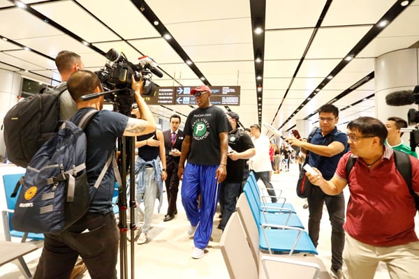 Former basketball player Dennis Rodman arrives at Changi Airport in Singapore