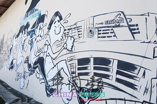 槟城中环广场还未开幕,但画家已经将之画入墙上了。