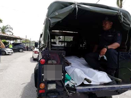 被数名男子连人带车掳走的华裔男子遗体由黑车载入医院太平间。（档案图片）