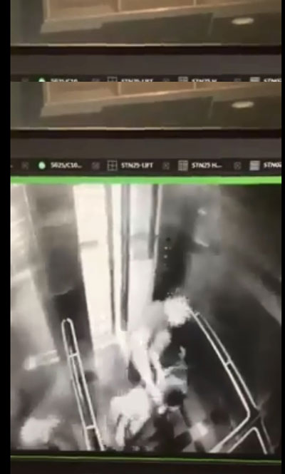 独行匪在升降机内对一名女子拳打脚踢。