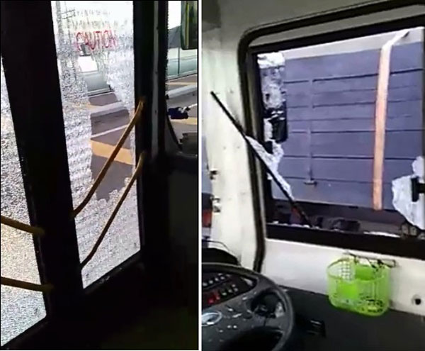 巴士车窗和门的玻璃遭货车司机打破，车上的司机及乘客都饱受惊吓。（视频截图）