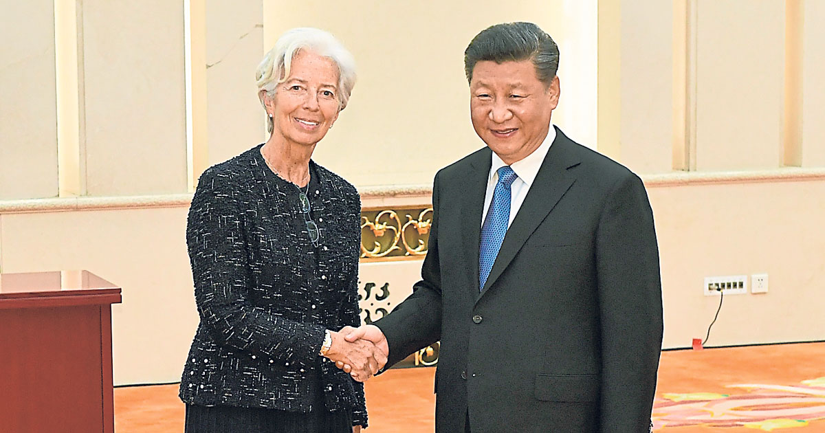 习近平周三会见国际货币基金组织总裁拉加德（左）。（法新社）