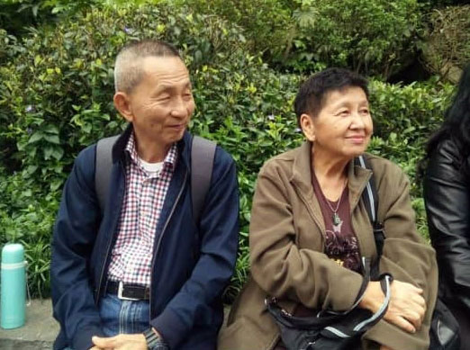 男死者陈金裕（左）及女死者吴长华在出国旅游时拍下的照片。（取自网络）