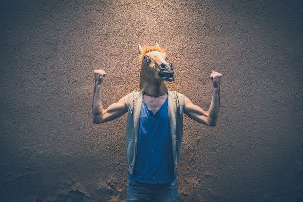 horse mask young hipster gay man in the city