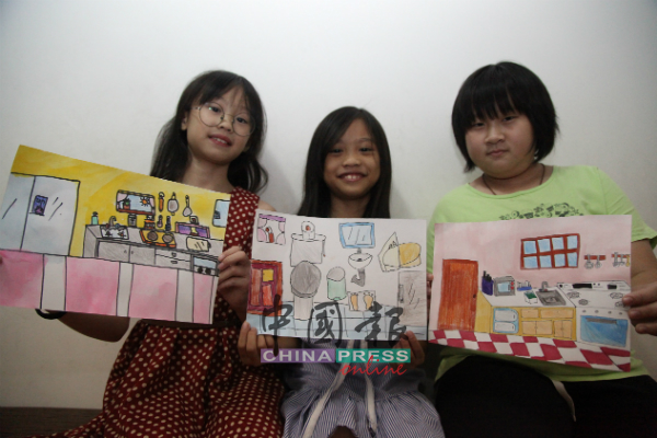 小朋友们展示马六甲中央医院安宁看护中心提升计划概念图。