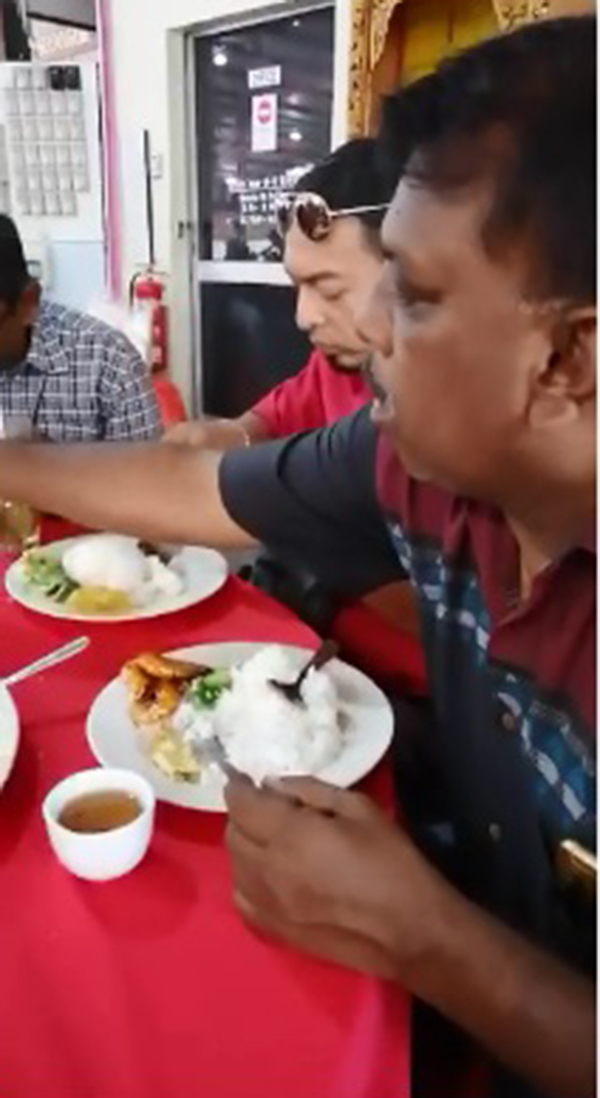拍摄者在视频中，显示各族人民和平和团结共进午餐。