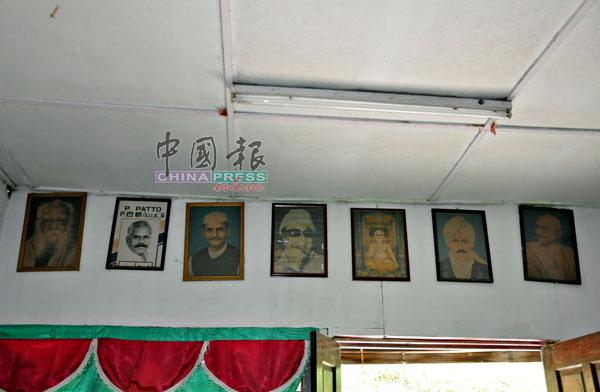 P古拿住家客厅的墙上挂着多名印度人政治领袖的肖像。