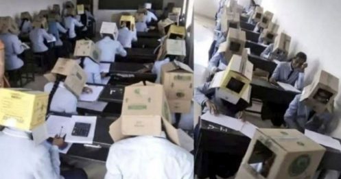 印度校方防作弊 学生头戴纸箱考试