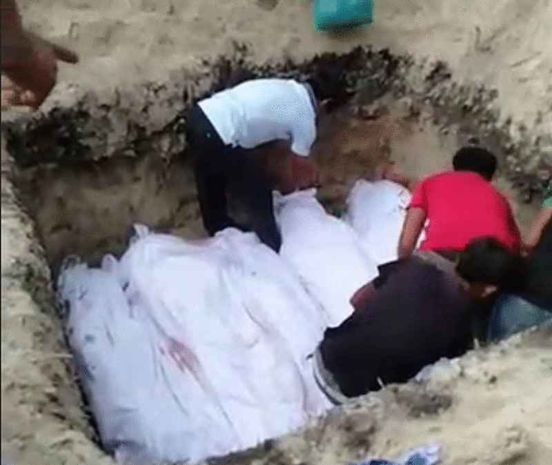 网上流传仙本那狄娜湾岛疑遭枪杀一家六口集体下葬的视频截图。