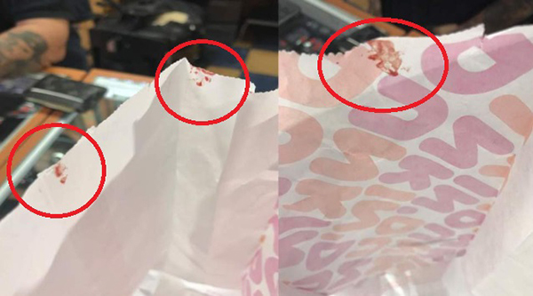 夫妇买甜甜圈，包装纸上也沾有血迹（红圈）。