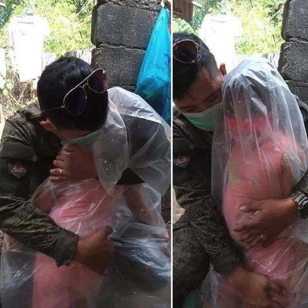 行动管制 军人担心自己受感染 塑料袋包起女儿才拥抱