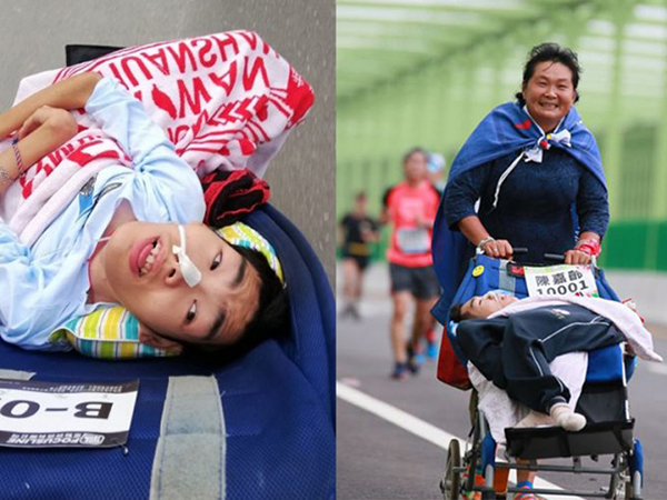 台湾单亲妈妈带脑瘫儿跑过134场马拉松。
