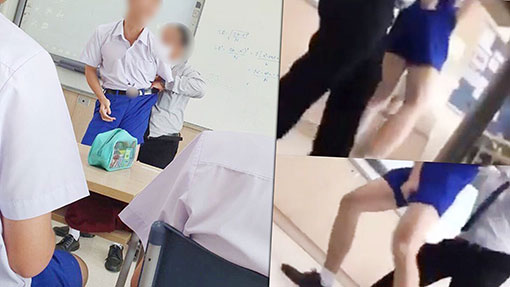 男教师用力提拉学生的裤子，让裤子紧紧地勒到学生的生殖器。