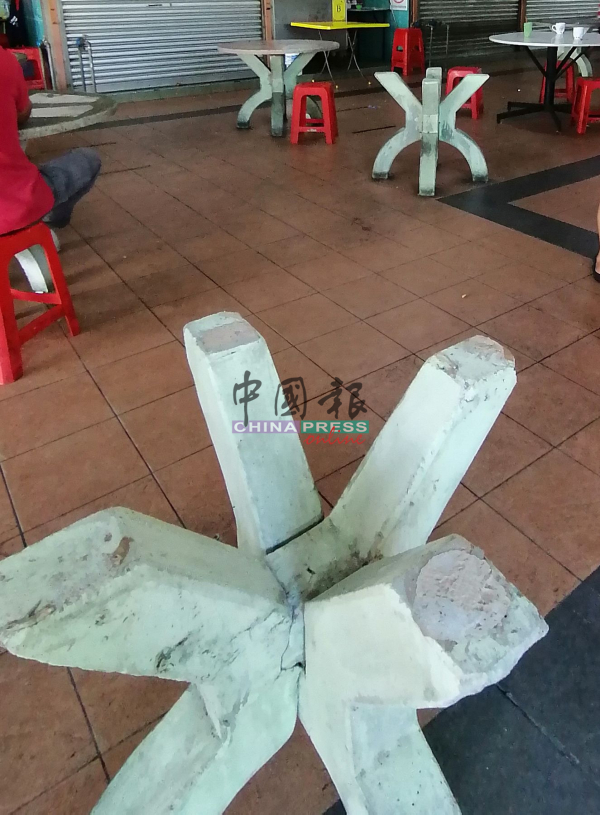 美食中心里的一些石桌已破损。