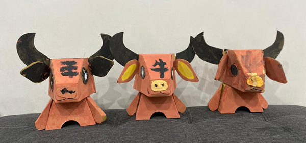 陈芷萱、陈财亿和陈芷仪三姐弟的纸皮牛。