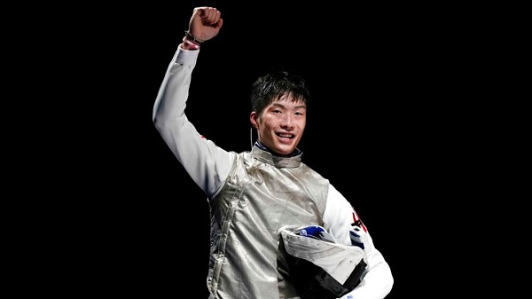 Ka Long Cheung of Hong Kong celebrates after winning the men's individual final Foil competition at the 2020 Summer Olympics, Monday, July 26, 2021, in Chiba, Japan. (AP Photo/Andrew Medichini)
