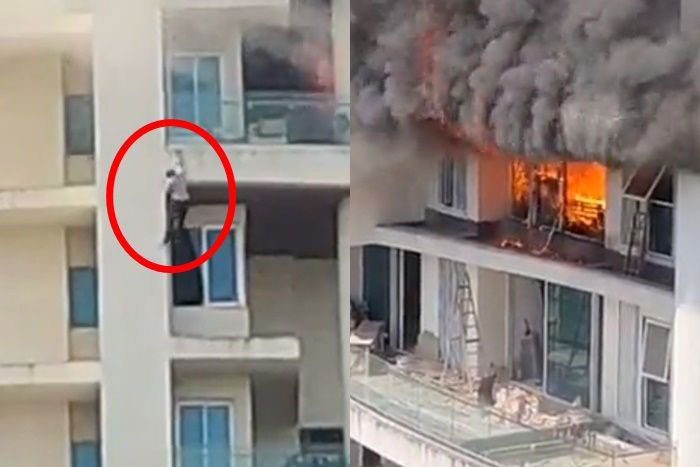 该栋60层楼高的住宅大楼发生火灾，起火点在第19楼。红圈为悬挂在19楼外墙的男子。