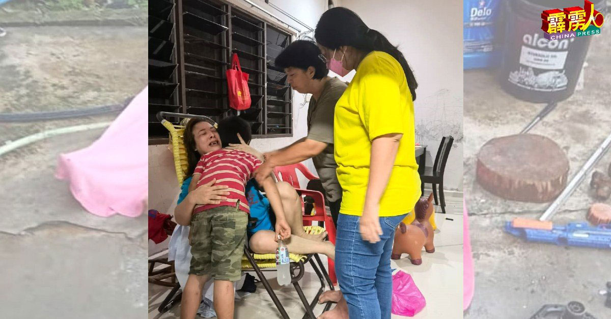 黄渼澐(右)安抚一天内痛失2名儿子的单亲母亲。