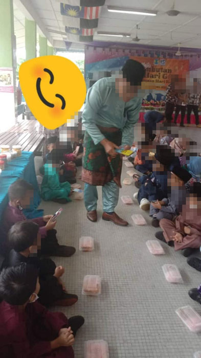 一所学校被揭露在办教师节活动时，学生被迫席地而坐吃饭。