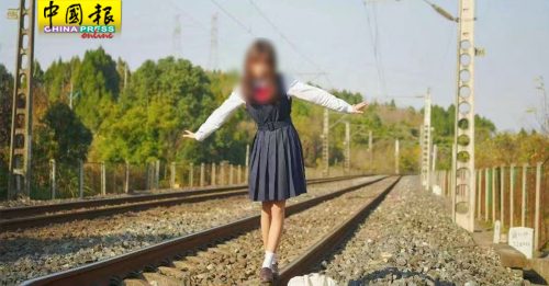 站铁轨玩命拍照 四川女大生与摄影师受罚