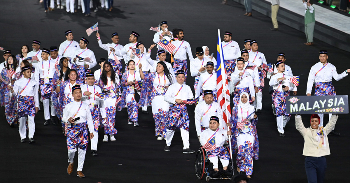 马来西亚代表团在共运会开幕式入场。（法新社）