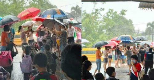 家長撐起傘道 為學生遮雨上校車