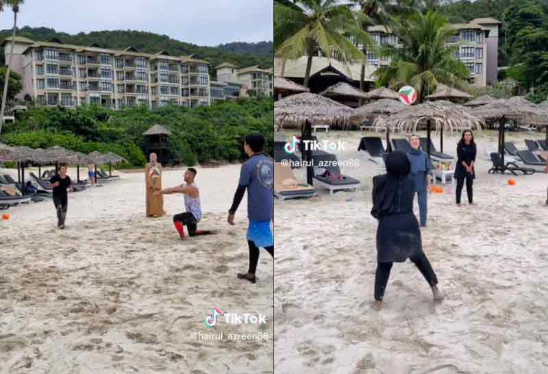 海鲁员工在沙滩打排球。