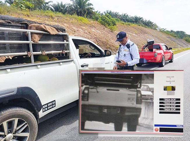 警员发出超速罚单予一辆超速的货卡的司机，并附上超速照片。