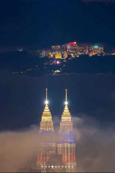 林荣捷在2月5日晚上，在同一个角度拍的夜景，唯当时云顶美景被云雾遮挡了。