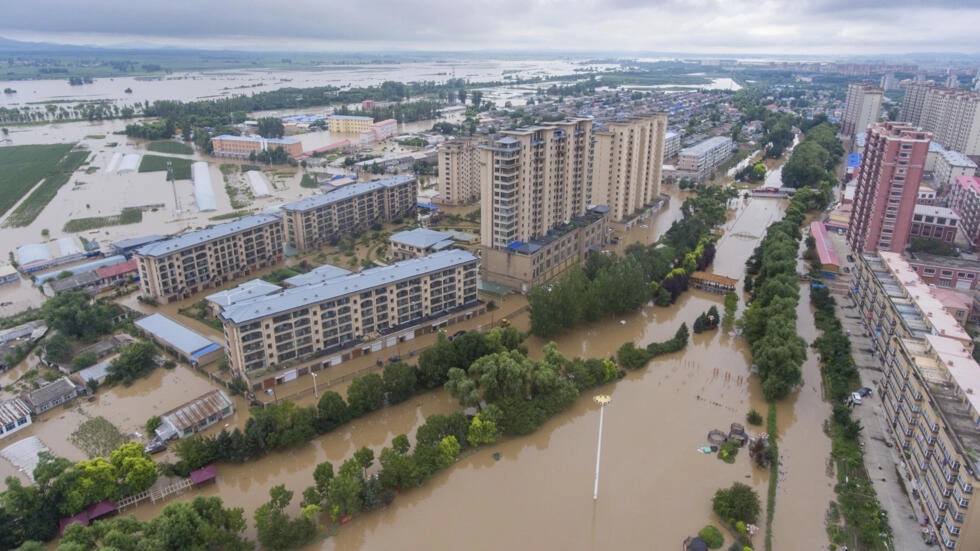 黑龙江省哈尔滨市延寿县5日洪灾惨况。（法新社）