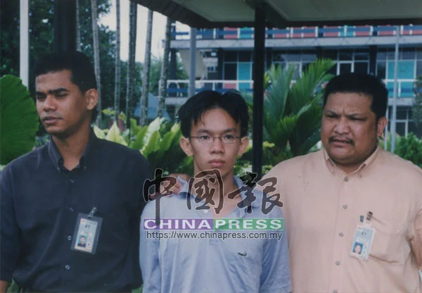 被告刘健文（译音，中）为这起谋杀案的主谋。