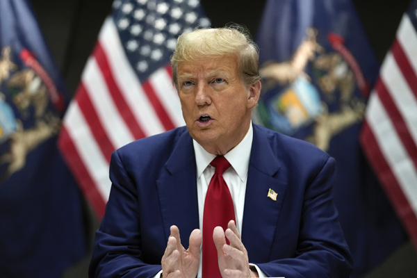 FILE - Republican presidential candidate former President Donald Trump speaks at a campaign event in Grand Rapids, Mich., Tuesday, April 2, 2024. Trump filed a law suit on March 24, suing two co-founders of Trump Media & Technology Group, the newly public owner of his Truth Social platform, arguing that they should forfeit their stock in the company after allegedly setting it up improperly.  (AP Photo/Paul Sancya, File)