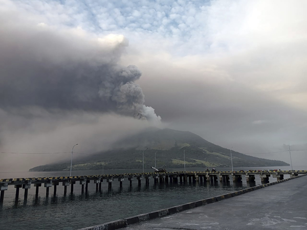 Mount Ruang volcano is seen during the eruption from Tagulandang island, Indonesia, Thursday, April 18, 2024. Indonesian authorities closed an airport and residents left homes near an erupting volcano Thursday due to the dangers of spreading ash, falling rocks, hot volcanic clouds and the possibility of a tsunami. (AP Photo/ Hendra Ambalao)