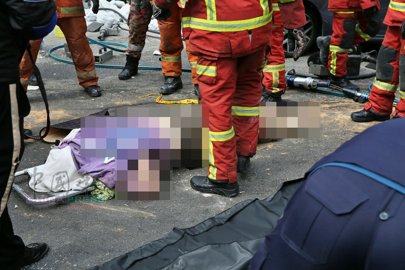 华裔司机证实夹毙 消拯员出动吊车 花2小时才移出遗体