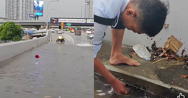 交警徒手疏通堵塞的排水道，引起网民狂赞。