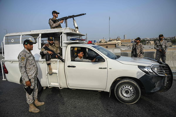 Security personnel stands guard near the Karachi Port in Karachi on May 9, 2025, amid the ongoing border tensions between India and Pakistan after the Kashmir tourist attack. Pakistan charged India on May 9 with bringing the nuclear-armed neighbours 