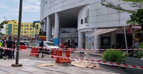 商场泊车场3楼坠下 文身男当场毙命