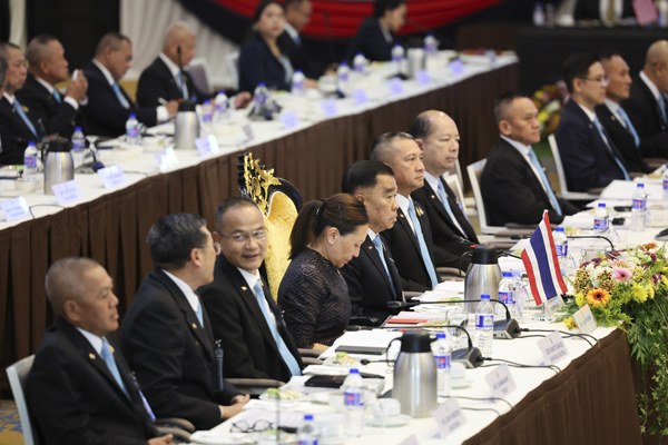 Thai delegates led by Deputy Defense Minister Natthaphon Narkphanit, fifth left, attend a meeting of the Extraordinary General Border Committee (GBC), with Cambodian delegates led by Defense Minister General Tea Seiha, to discuss their border dispute between Cambodia and Thailand, as hosted by Malaysian Home Minister Saifuddin Nasution Ismail, in Kuala Lumpur, Malaysia, Thursday, Aug. 7, 2025. (Hasnoor Hussain/Pool Photo via AP)