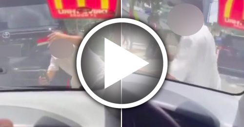 不满强行超车被鸣笛 华裔德士司机 肉身挡车 敲打车盖