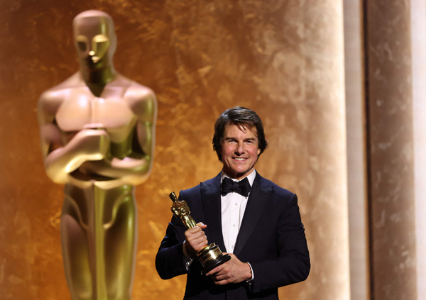 TOPSHOT - US actor producer Tom Cruise poses with his Honorary Academy Award on stage during the 16th Governors Awards at the Ray Dolby Ballroom at Ovation Hollywood in Los Angeles on November 16, 2025. (Photo by Michael Tran / AFP)